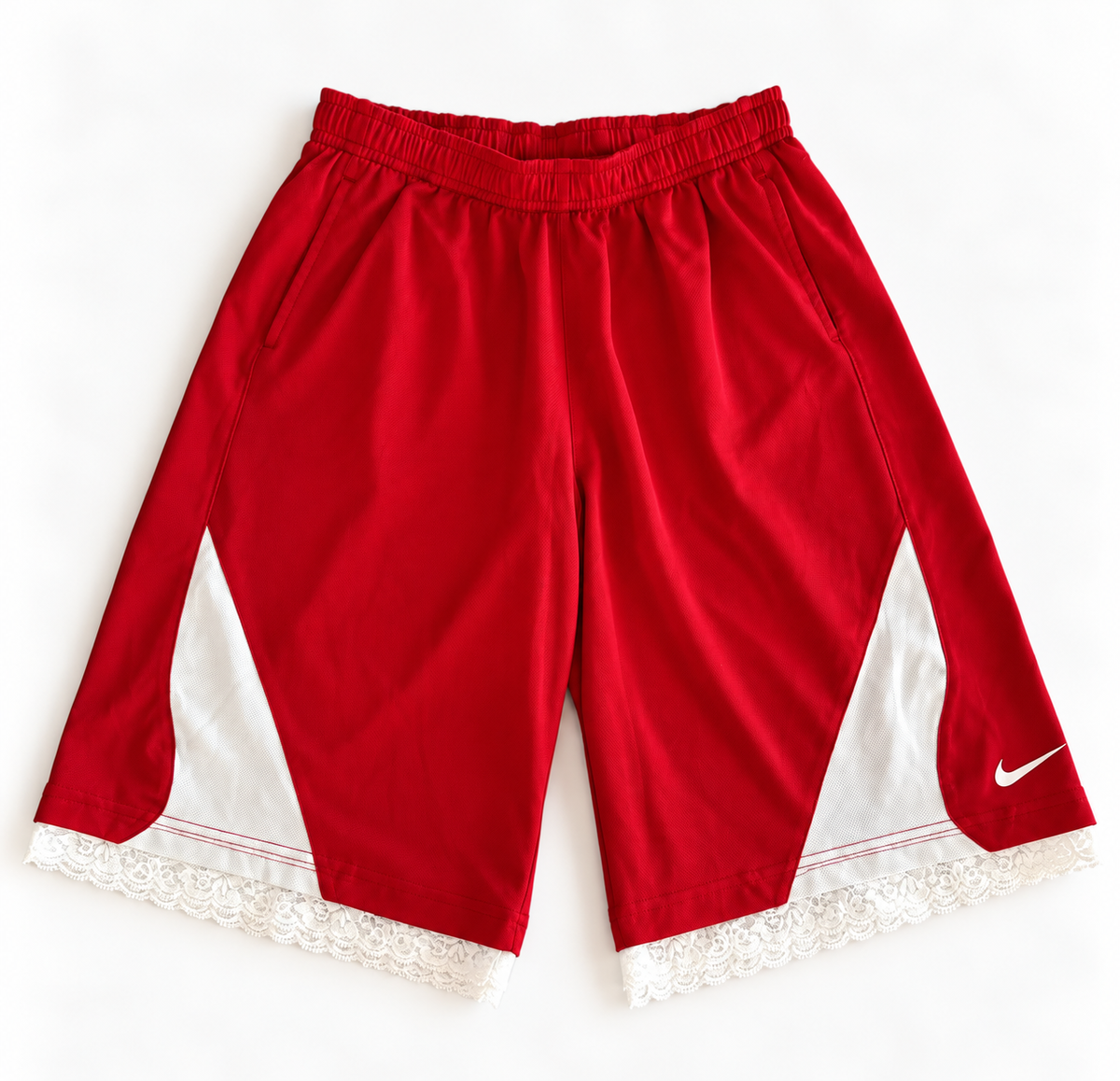 Red and white reworked vintage Nike basketball shorts with white lace hem, DAMECORE